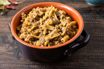 Pasta and lentils served on a ceramic bowl. Mediterranean food naturally vegan.