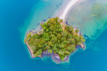 Aerial view showcasing an island and beach at Lake Oppstrynsvattnet in Norway during the daytime