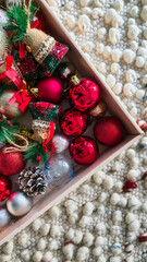 Box filled with colorful Christmas ornaments and decorations