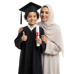 Proud Muslim mother in hijab hugging young son in graduation gown holding diploma and giving thumbs up