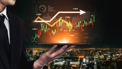 A businessman stands against a breathtaking city skyline, holding a tablet that displays dynamic financial graphs and stock market trends, symbolizing investment success. Scalp