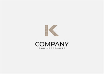 Fototapeta premium Creative Professional Vector Logo Featuring the Letter K Designed with a Tan Woven Parquet Pattern for Interior Design or Textile Brand Identity