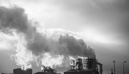 Industrial factory emitting smoke pollution into the atmosphere