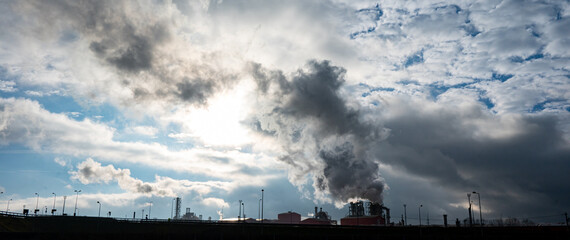 Industrial factory emitting smoke pollution into the atmosphere