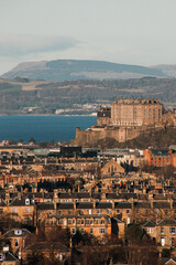 view of Edinburgh castle and the cliffs from a distance