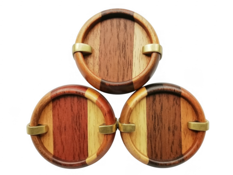 Three wooden coasters with gold accents brown isolated on a transparent background - Powered by Adobe