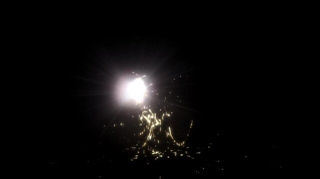 Bright white energy burst with golden sparks explosion on dark background cinematic light flash abstract effect animation