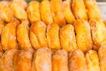 Round churros being fried in Medellin, Colombia