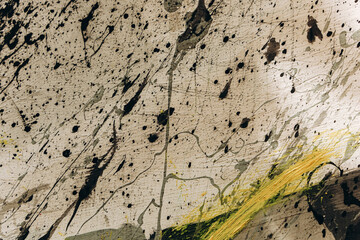 Creative splashes and patterns on a white canvas in an art studio during daytime