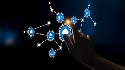 A hand reaching towards a digital cloud icon connected to various nodes, illustrating modern technology themes and connectivity in a sleek, dark environment. Tessel