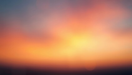 Blurred abstract of a sunset sky featuring orange tones and natural light, suitable for environmental themes or layouts