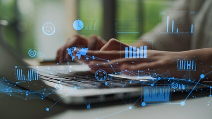 A business professional works on a laptop in a modern workspace, surrounded by digital graphs and metrics, representing data analysis and productivity in action. Xenic