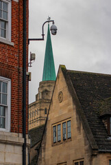 Beautiful Oxford architecture. Old brick buildings with fairytale roof. Street photography of Oxford on a cloudy winter day.