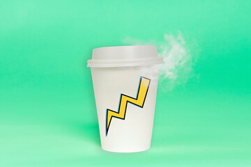 Disposable coffee cup with steam coming from hot drink isolated on plain background