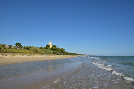 The sandy beach of Pineto (Italy) With the famous tower castle called Torre di Celano. 