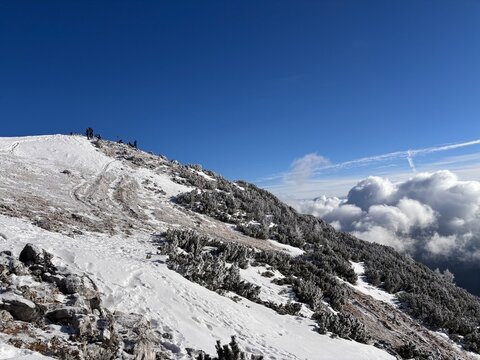 Julian Alps in Slovenia winter landscape, path to Debela pec peak