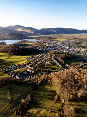Fototapeta premium Aerial of small mountain town at sunset - Keswick, Cumbria