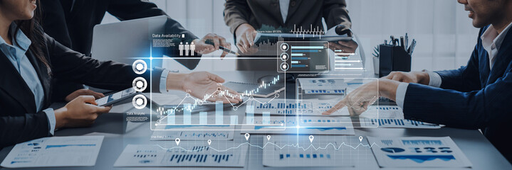 Engaging modern business meeting focused on data analytics and growth strategies, showcasing teamwork and technology integration in a dynamic office environment. Trope