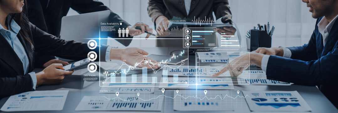 Engaging modern business meeting focused on data analytics and growth strategies, showcasing teamwork and technology integration in a dynamic office environment. Trope - Powered by Adobe