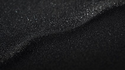 Dark sand surface used to create a textured UI backdrop for digital interfaces