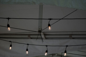 A lightbulb on wire in tent