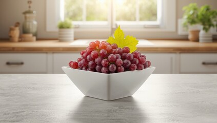 Cluster of red grapes served in a white bowl emphasizing fresh produce for diet planning