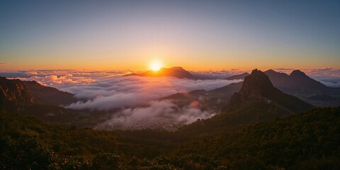 Morning light over Madeira Islands northern coast illuminates a cloud-filled cityscape, attracting tourism and outdoor activities