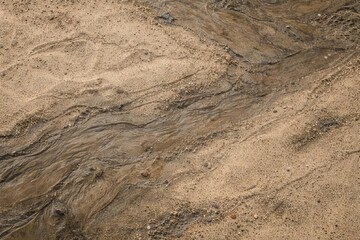 Natural textured backdrop with fine sand and mud details
