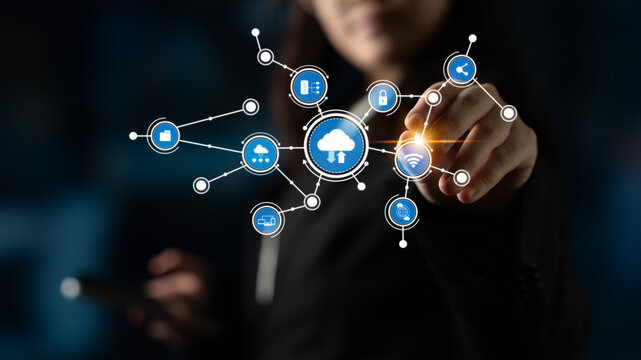 A business professional engages with a virtual interface showcasing cloud computing and data connections, emphasizing modern technology and digital interaction for future solutions. Tessel - Powered by Adobe