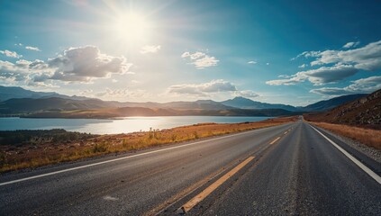 Obraz premium Mountain-lined coastal highway during summer, emphasizing travel efficiency in a scenic environment