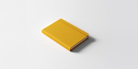 Closed yellow notebook with smooth cover serving as a writing surface background, stationery arrangement, World Book Day