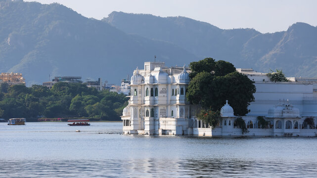 Historic Taj lake palace hotel exterior view in the middle of scenic Lake Pichola in Udaipur.