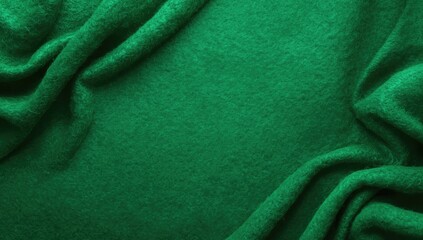 Fototapeta premium Textile surface on green felt background with fabric texture for editorial header background, Earth Day