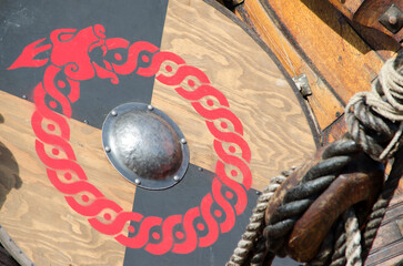 Close-up of replica viking shield with a red image of a dragon