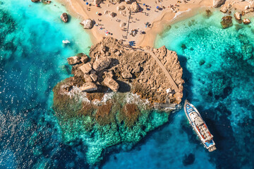 Drone aerial rocky cove Sardinia with boat