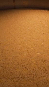 Rapidly bubbling fermentation vat for bourbon or beer production vertical video