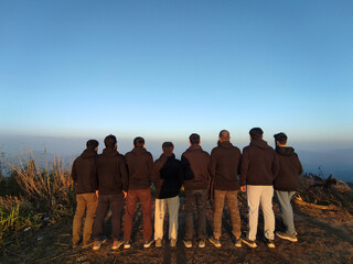 Team Bonding Adventure With Coworkers On Top Of Mountain