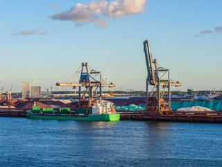 Cargo ship loading ore at Maasvlakte industrial port
