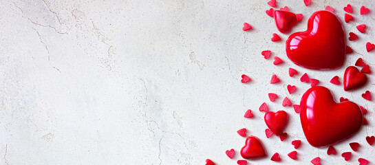 Red Heart Shapes on Textured White Background: Romantic and Minimalist Valentine's Day Composition