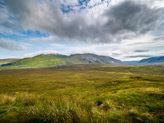 Fototapeta premium Scottish Highlands landscape showing mountains and green valley