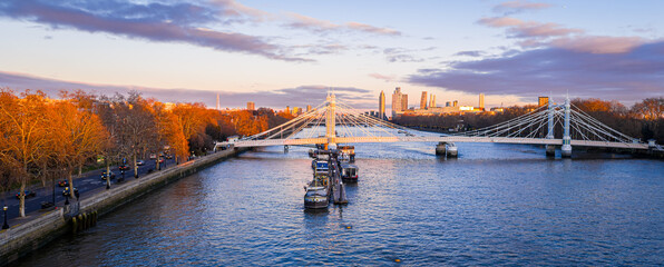 Naklejka premium Albert Bridge panoramic view over River Thames at sunset, Chelsea London UK
