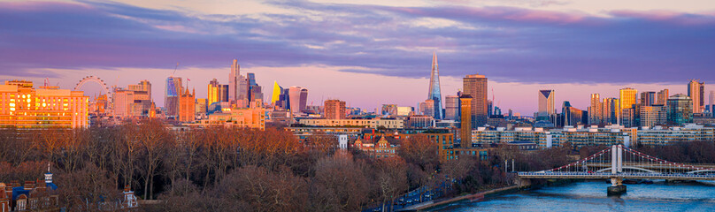 Fototapeta premium London skyline panoramic sunset with London Eye and City skyscrapers, UK