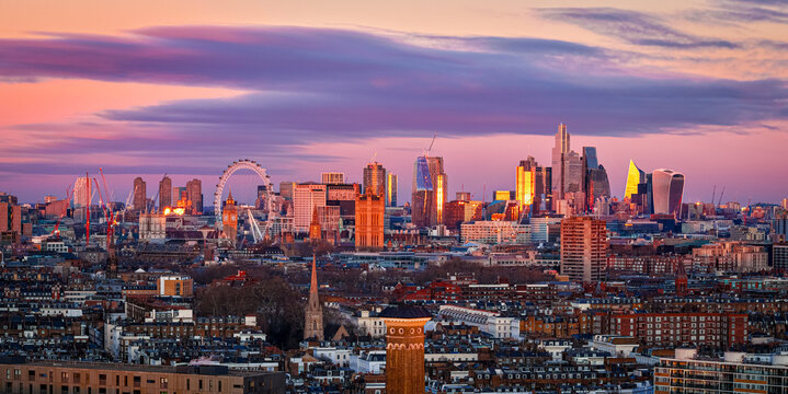 London skyline panoramic sunset with London Eye and City skyscrapers, UK