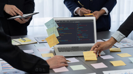 Analyst team use sticky note for creative and analytic brainstorm for business idea with BI data dashboard on laptop screen. Analysis financial data visualization tech for marketing strategy. Prodigy