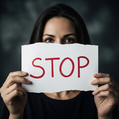 Woman Holding Stop Sign to End Abuse and Violence