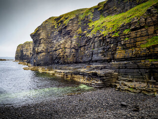 Layered rock cliffs along coastal Caithness, Wick, Scotland