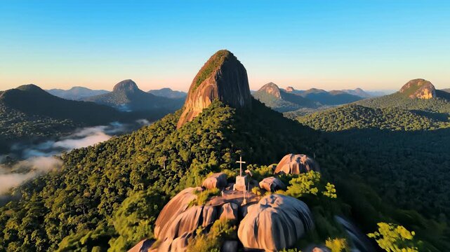 Majestic mountain range with prominent rock formation dominating center, showcasing exploration, discovery, and adventure, inviting users to imagine themselves soaring above landscape in search.