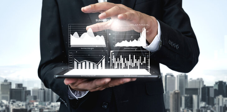 A business professional engages audiences with a tablet displaying impressive data visualizations, showcasing financial charts above a bustling city skyline. Impute - Powered by Adobe