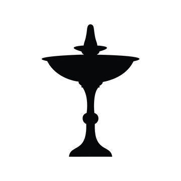 Detailed silhouette of an ornate bird bath or fountain on white