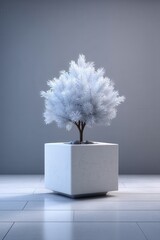 Minimalist white tree in a white speckled pot on a clean modern floor for a serene home decor scene